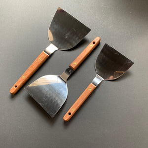 Okonomiyaki utensils with a wooden handle