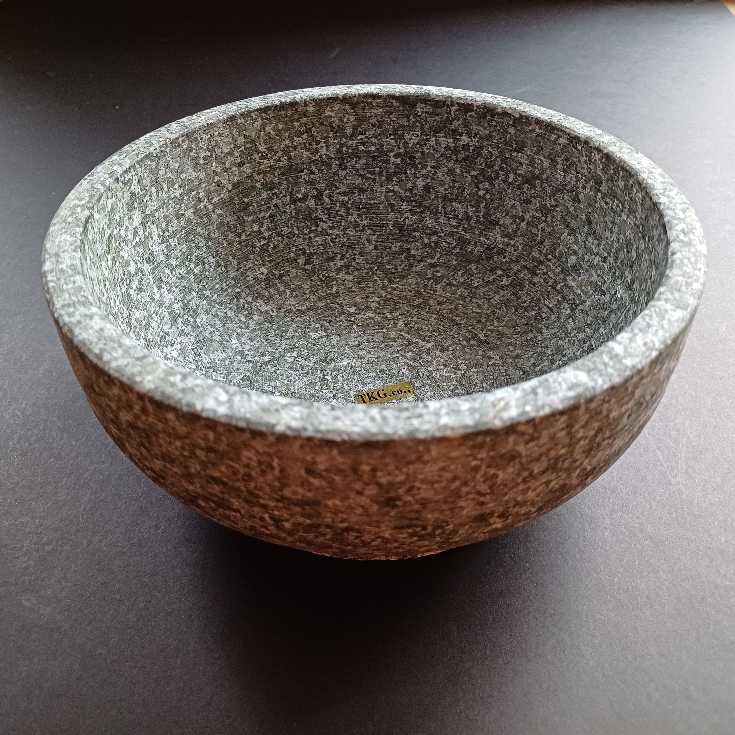 Dolsot bowl with a wooden stand