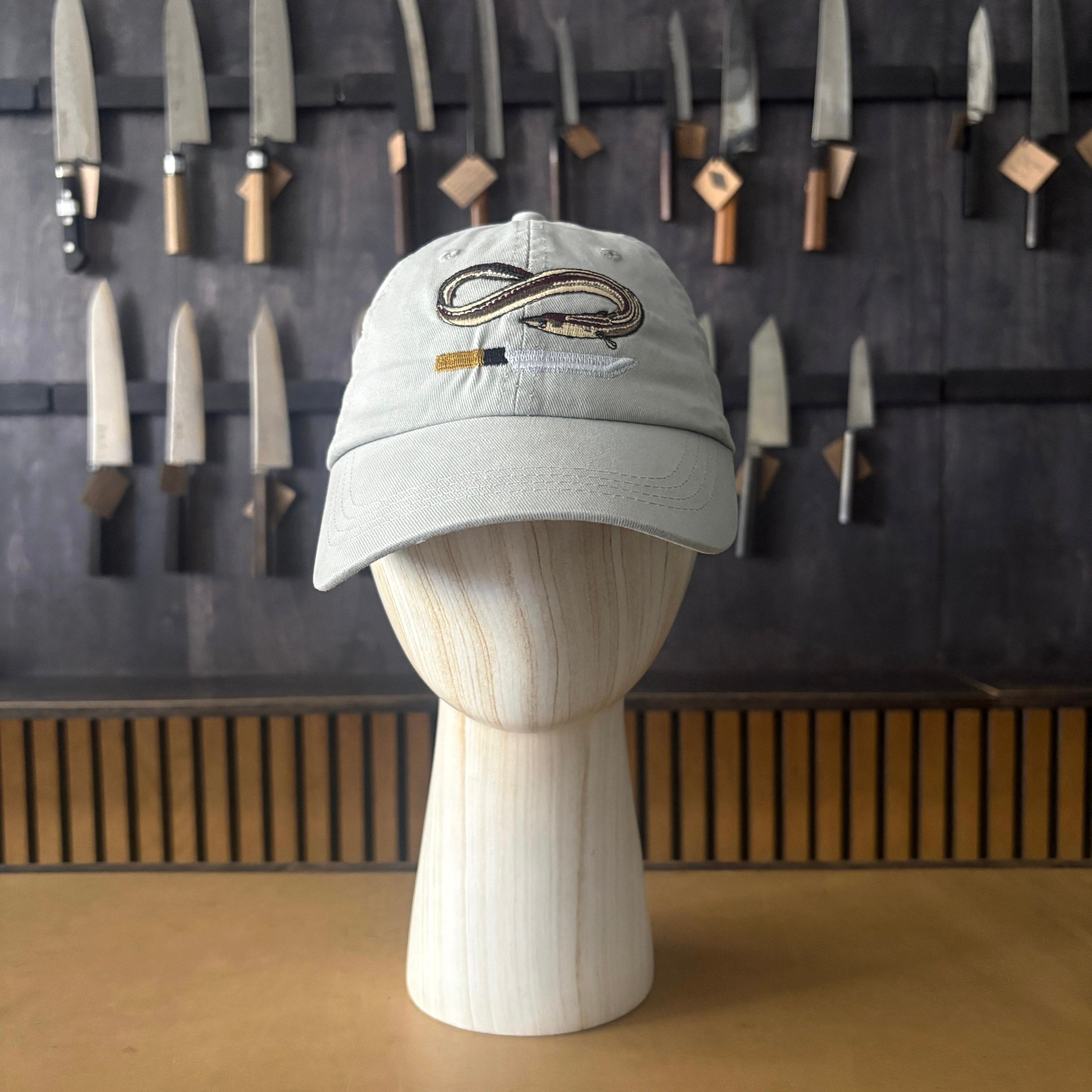 Kitchen Provisions Merch - the eel cap