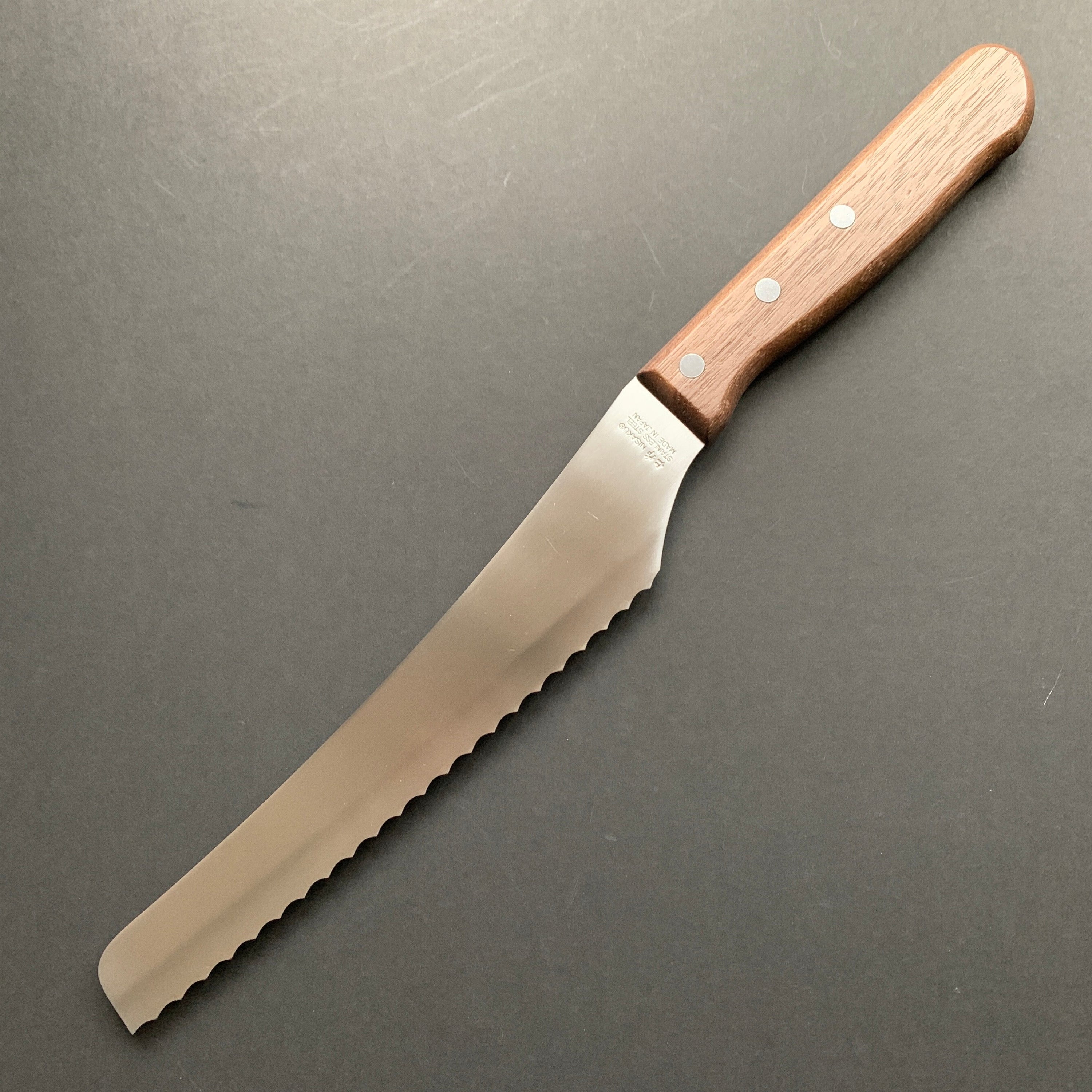 Serrated pastry / bun knife, dark wood handle
