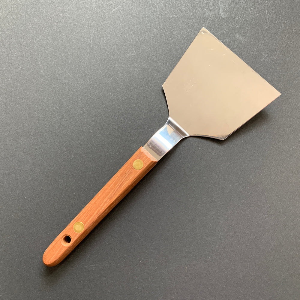 Okonomiyaki utensils with a wooden handle