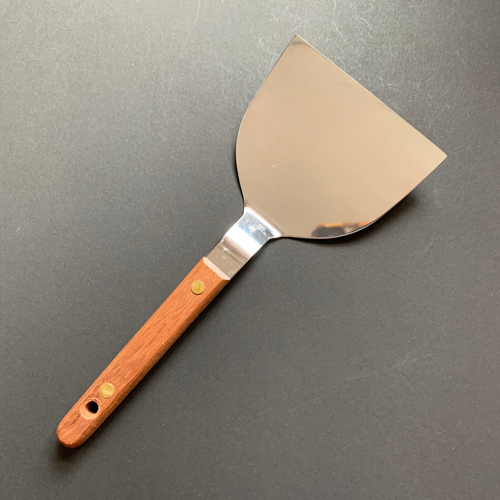 Okonomiyaki utensils with a wooden handle