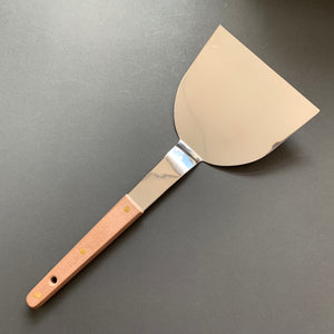 Okonomiyaki utensils with a wooden handle